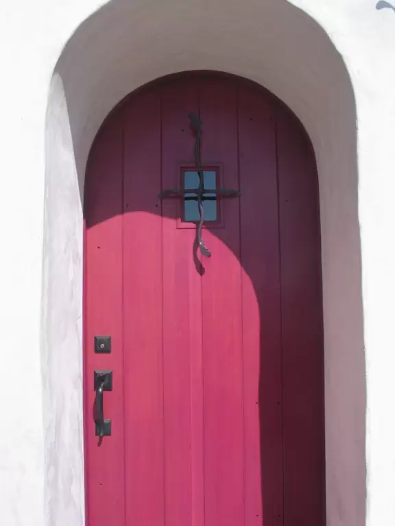 Whimsical masterpiece townhouses of vibrant colors, white-washed curves, and exquisite details, plus a Saturday farmer's market.
