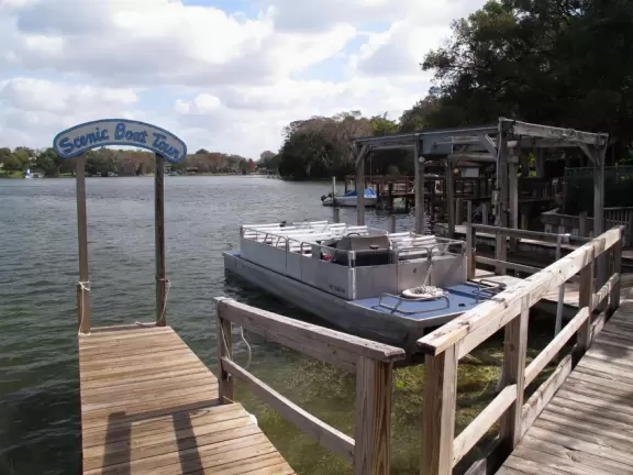Gorgeous main street with large, European-style park where people sit on the grass by the fountain.
