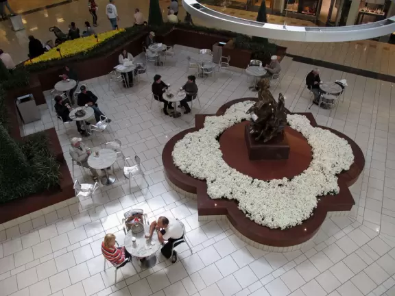 Beautiful indoor two-level mall with ritzy shops, upscale chain restaurants, and a food court.