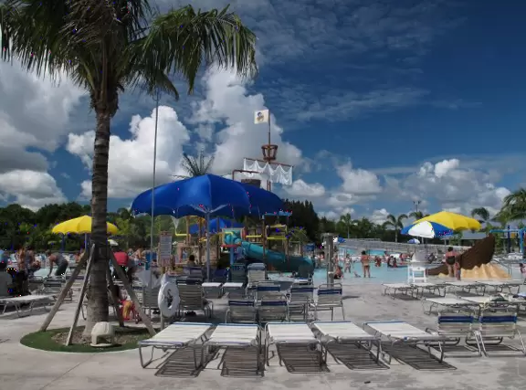 Colorful waterpark with lovely lazy river, two tall slides, and water playground with guns, huge bucket of water, and small slides. Beware the biting ants!