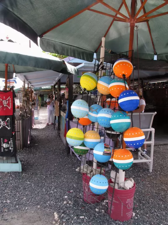 Touristy but pleasant stalls with jewelry and souvenirs, under the trees. Plus boat trips and kayak rental.