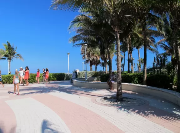 Gorgeous ocean colors, fun crowd of families, shallow water with little bouncy waves.