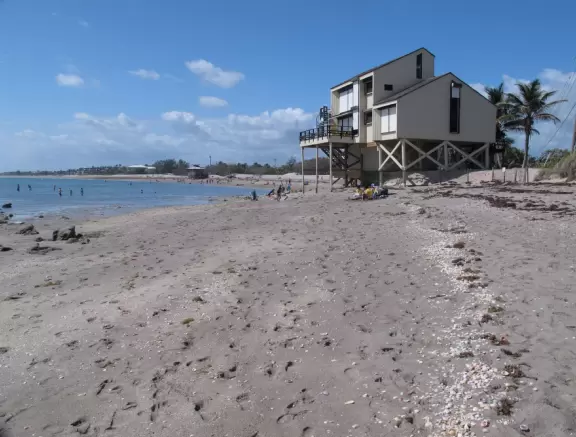 Ultra-shallow clear waters protected by a reef make this a perfect swimming spot for very young children.
