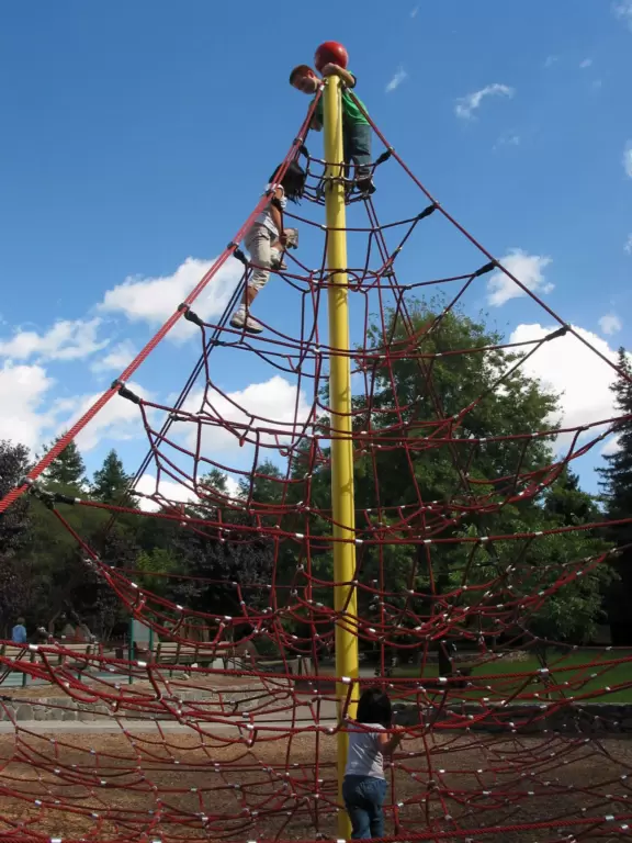 A super fun playground with a giant space net, carousel, pony rides, train rides, and dog-friendly hiking and bike trails around a lake.