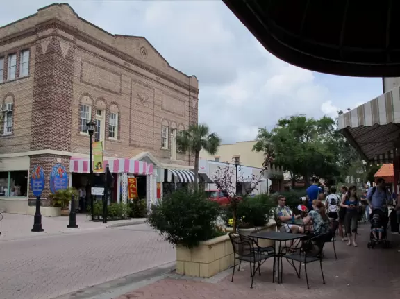 A cute historic area with sidewalk cafes and a waterfront park.