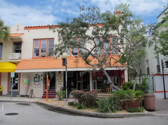 A cute historic area with sidewalk cafes and a waterfront park.