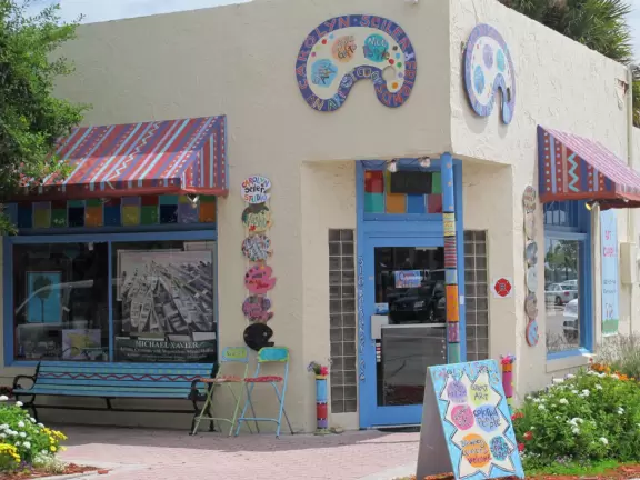 A cute historic area with sidewalk cafes and a waterfront park.