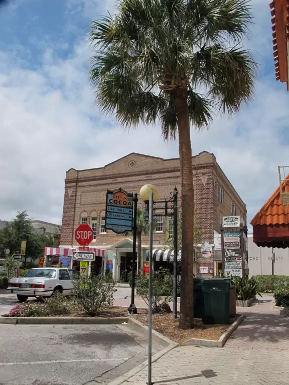 A cute historic area with sidewalk cafes and a waterfront park.