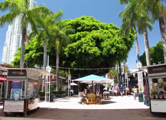 A touristy waterfront mall with restaurants and stalls with souvenirs.
