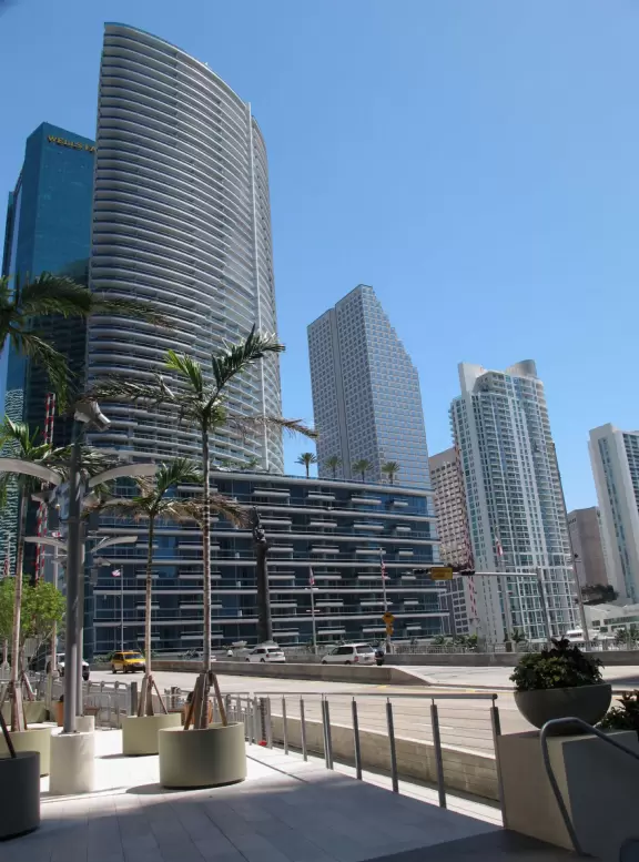 Unique glass skyscrapers reaching up to the perfect blue sky.