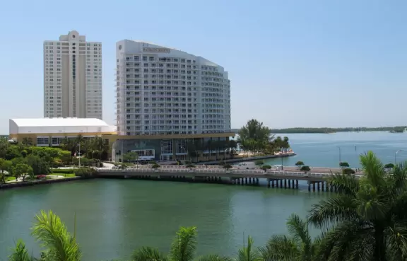 Unique glass skyscrapers reaching up to the perfect blue sky.