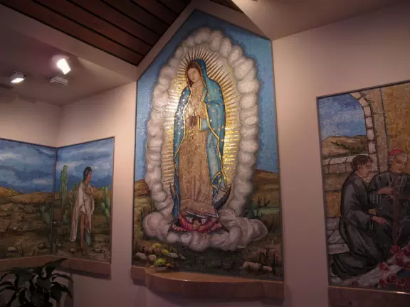 Beautiful modern basilica with gift shop, water lilies, stained glass, rose window, organ and exceptional choir.