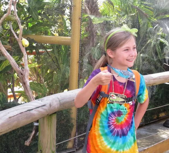 Claustrophobic aquarium with great outdoor exhibit where you can feed parakeets.