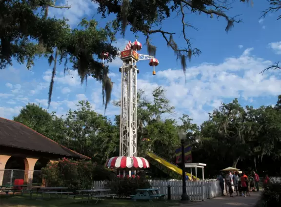 An old-fashioned amusement park amongst gorgeous moss-draped giant oaks.