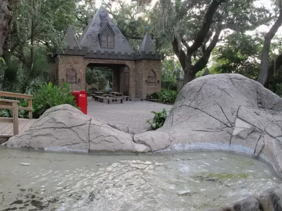 Whimsical sculptures of fairy tale scenes in the middle of a giant oak forest with Spanish moss and vines. Magic!