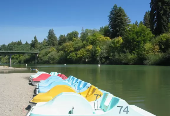 A wide, pebbly shore where you can enter the Russian River on kayak or paddleboat, have a beer, or walk the historic Guerneville Bridge.
