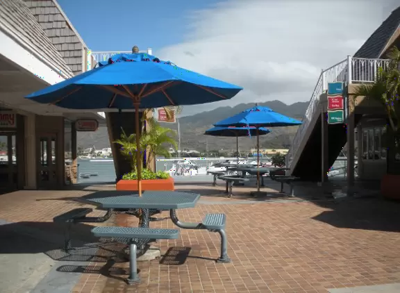 A marina and shopping center with romantic views and places to eat.