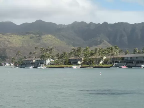 A marina and shopping center with romantic views and places to eat.