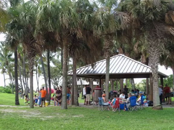 Island in the intracoastal, with old Coast Guard house and Kennedy bunker, plus a party crowd.