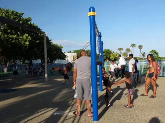Beach with shallow, warm water, and space-age playground under shade canopy!