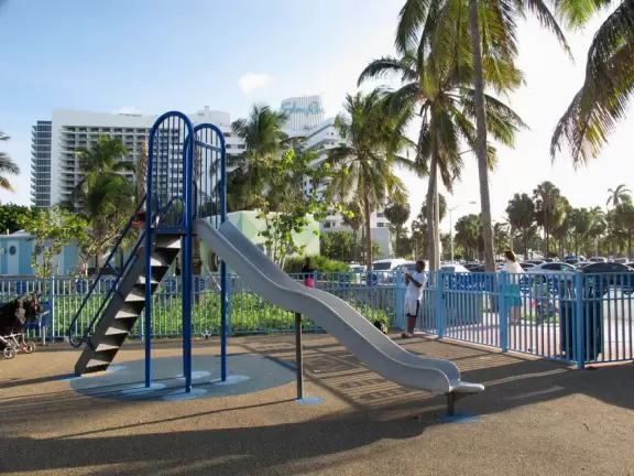 Beach with shallow, warm water, and space-age playground under shade canopy!