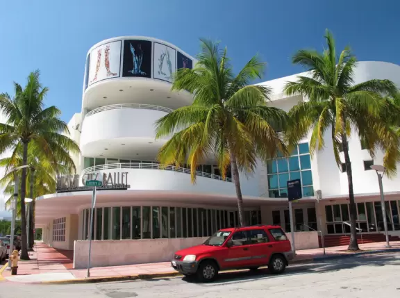 Gorgeous ocean colors, fun crowd of families, shallow water with little bouncy waves.